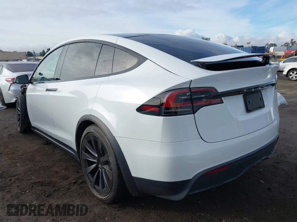 2023 Tesla Model X with VIN 7SAXCBE54PF384403, listed as a IAAI auction lot 40947187 with 16,881 mi miles and . Bid and sale history available at DreamBid. Image 3.