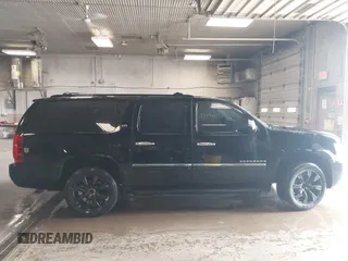 2010 Chevrolet Suburban LTZ with VIN 1GNUKKE39AR106851, listed as a IAAI auction lot 41994155 with 148,776 mi miles. Bid and sale history available at carsss.com. Image 13.