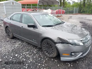 2011 Ford Fusion Hybrid with VIN 3FADP0L32BR238153, listed as a IAAI auction lot 42113064 with 145,932 mi miles and . Bid and sale history available at DreamBid. Image 1.