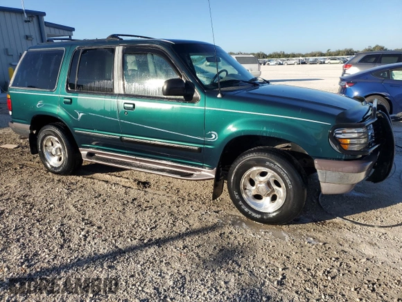 1997 Ford Explorer XL with VIN 1FMDU34E5VZB40878, listed as a Copart auction lot 84009744 with 185,047 mi miles and Salvage title. Bid and sale history available at DreamBid. Image 4.