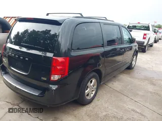 2013 Dodge Grand Caravan SXT with VIN 2C4RDGCG0DR552784, listed as a IAAI auction lot 42116395 with 96,917 mi miles and . Bid and sale history available at DreamBid. Image 4.