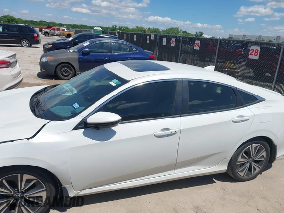 2018 Honda Civic EX-T z VIN JHMFC1F3XJX001723, wystawiony jako IAAI lot #42228776 z przebiegiem 97 432 mil mil oraz . Historia ofert i sprzedaży dostępna na DreamBid. Obrazek 14.