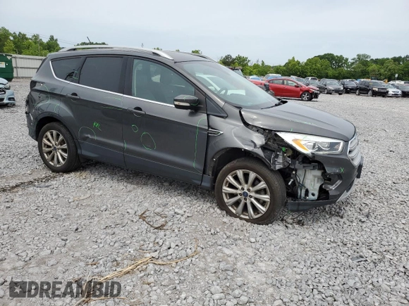 2018 Ford Escape Titanium with VIN 1FMCU9J97JUB34691, listed as a Copart auction lot 56404625 with 107,037 mi miles and Salvage title. Bid and sale history available at DreamBid. Image 4.