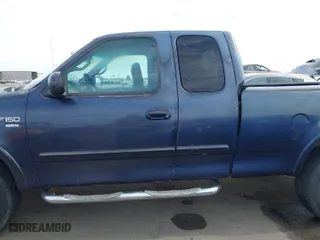 2000 Ford F-150 XL with VIN 1FTRX18L2YKA10388, listed as a IAAI auction lot 41526430 with 144,480 mi miles. Bid and sale history available at carsss.com. Image 14.