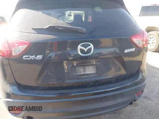 2016 Mazda CX-5 Touring with VIN JM3KE2CY6G0808992, listed as a IAAI auction lot 40969655 with 132,513 mi miles. Bid and sale history available at carsss.com. Image 16.