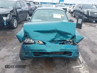 1998 Ford Escort z VIN 3FALP1137WR145199, wystawiony jako IAAI lot #41677279 z przebiegiem 92 232 mil mil oraz . Historia ofert i sprzedaży dostępna na DreamBid. Obrazek 13.