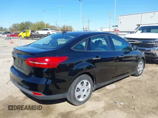 2018 Ford Focus S with VIN 1FADP3E29JL259004, listed as a IAAI auction lot 41841485 with 77,567 mi miles. Bid and sale history available at carsss.com. Image 4.