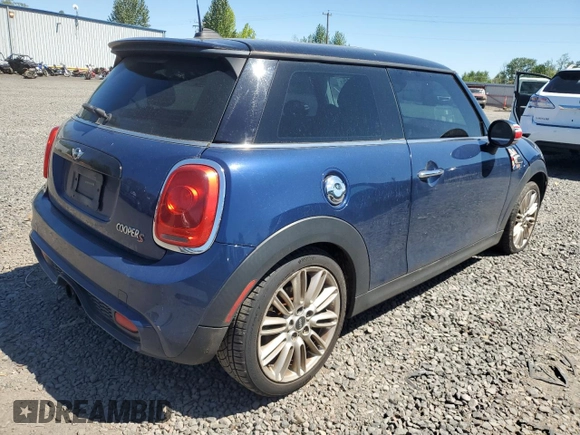 2014 MINI Hardtop S with VIN WMWXM7C51ET926090, listed as a Copart auction lot 55958745 with 148,997 mi miles and Salvage title. Bid and sale history available at DreamBid. Image 3.