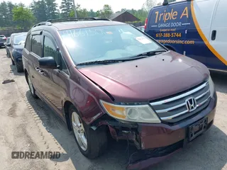 2012 Honda Odyssey Touring with VIN 5FNRL5H94CB067852, listed as a IAAI auction lot 42472576 with 200,547 mi miles and . Bid and sale history available at DreamBid. Image 1.