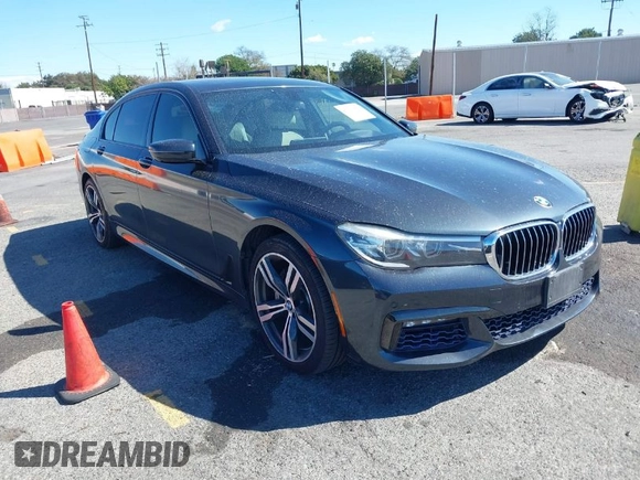 2016 BMW 7 Series 740i with VIN WBA7E2C52GG548048, listed as a IAAI auction lot 41701806 with 72,680 mi miles. Bid and sale history available at carsss.com. Image 1.