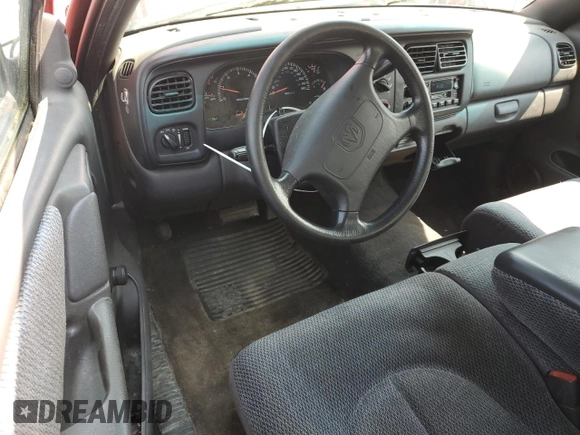 1999 Dodge Dakota SLT z VIN 1B7GL22X6XS243645, wystawiony jako Copart lot #54258675 z przebiegiem 114 362 mil mil oraz Czysty tytuł • Clean title. Historia ofert i sprzedaży dostępna na DreamBid. Obrazek 8.