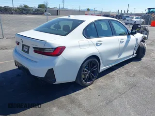 2023 BMW 3 Series 330e with VIN 3MW39FF02P8C89795, listed as a IAAI auction lot 41648172 with 27,179 mi miles. Bid and sale history available at carsss.com. Image 4.