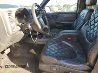 2000 GMC Jimmy SLE Convenience with VIN 1GKDT13WXY2248355, listed as a Copart auction lot 75437384 with 188,694 mi miles and Salvage Title. Bid and sale history available at carsss.com. Image 7.