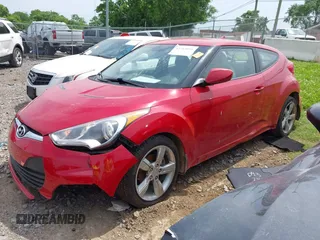 2012 Hyundai Veloster w/Black Int with VIN KMHTC6AD7CU049570, listed as a IAAI auction lot 42265051 with 79,896 mi miles and . Bid and sale history available at DreamBid. Image 2.