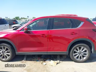 2021 Mazda CX-5 Grand Touring with VIN JM3KFADM4M0476615, listed as a IAAI auction lot 42004814 with 42,483 mi miles. Bid and sale history available at carsss.com. Image 14.