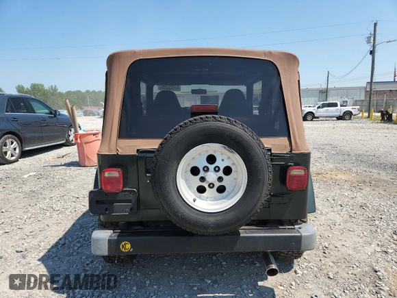 1997 Jeep Wrangler Sahara with VIN 1J4FY49S3VP519387, listed as a Copart auction lot 63822395 with 187,884 mi miles and Salvage title. Bid and sale history available at DreamBid. Image 6.