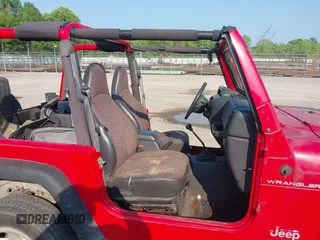 2000 Jeep Wrangler SE with VIN 1J4FA29P6YP775127, listed as a IAAI auction lot 42377387 with Not provided miles and . Bid and sale history available at DreamBid. Image 5.