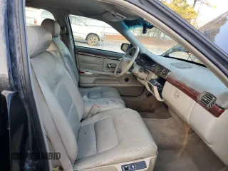 1999 Cadillac DeVille z VIN 1G6KD54Y5XU767438, wystawiony jako Copart lot #86133764 z przebiegiem Nie podano mil oraz Nie do naprawy • Non repairable. Historia ofert i sprzedaży dostępna na DreamBid. Obrazek 7.