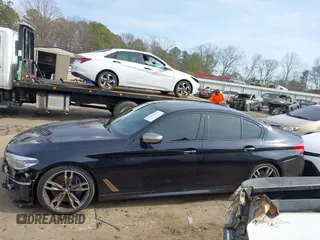 2018 BMW 5 Series M550i xDrive with VIN WBAJB9C50JB036400, listed as a IAAI auction lot 41464278 with 139,079 mi miles and . Bid and sale history available at DreamBid. Image 14.