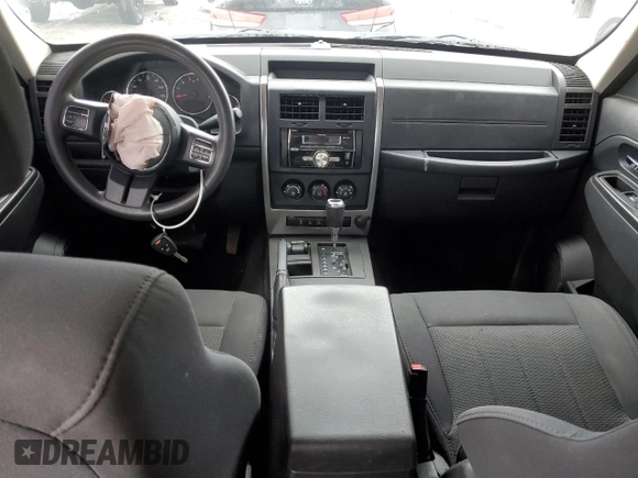 2011 Jeep Liberty Sport with VIN 1J4PN2GK4BW543087, listed as a Copart auction lot 59131595 with 127,989 mi miles and Salvage title. Bid and sale history available at DreamBid. Image 8.