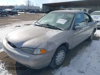 1996 Ford Contour LX с VIN 1FALP6530TK105053, выставлен на аукционе IAAI как лот 41287231 с пробегом 115 177 миль миль и . История ставок и продаж доступна на DreamBid. Изображение 2.