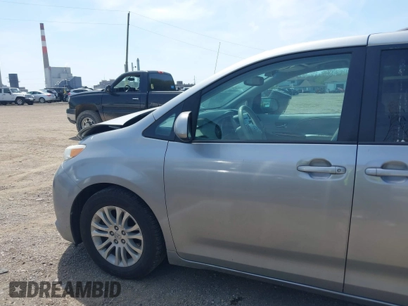 2014 Toyota Sienna XLE with VIN 5TDYK3DC9ES413283, listed as a IAAI auction lot 42091379 with 184,506 mi miles and . Bid and sale history available at DreamBid. Image 14.