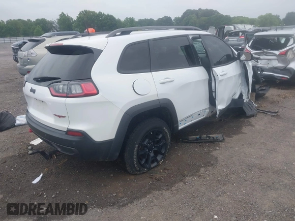 2021 Jeep Cherokee Trailhawk with VIN 1C4PJMBX4MD239112, listed as a IAAI auction lot 42271040 with 62,917 mi miles and . Bid and sale history available at DreamBid. Image 4.