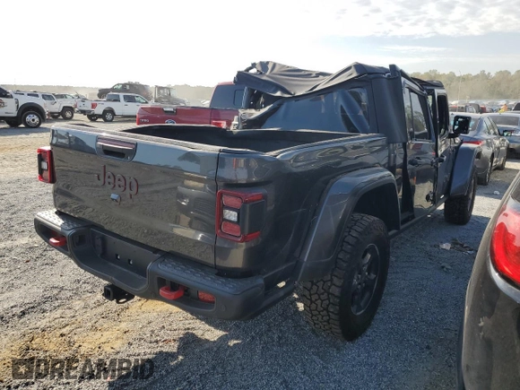 2023 Jeep Gladiator Rubicon с VIN 1C6JJTBGXPL574702, выставлен на аукционе Copart как лот 75914474 с пробегом 10 506 миль миль и Списание • Salvage title. История ставок и продаж доступна на DreamBid. Изображение 3.