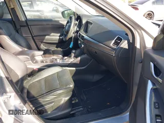 2016 Mazda CX-5 Grand Touring z VIN JM3KE2DY3G0712249, wystawiony jako IAAI lot #37910910 z przebiegiem 262 058 mil mil oraz . Historia ofert i sprzedaży dostępna na DreamBid. Obrazek 5.