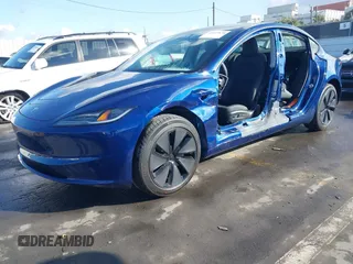 2025 Tesla Model 3 Long Range with VIN 5YJ3E1EA2SF915586, listed as a IAAI auction lot 41495870 with 4 mi miles and . Bid and sale history available at DreamBid. Image 2.