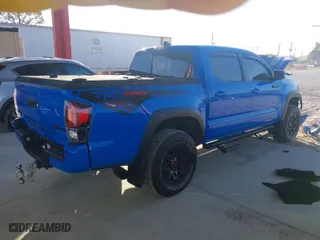 2019 Toyota Tacoma 4WD SR with VIN 5TFCZ5AN9KX197898, listed as a IAAI auction lot 41304019 with 111,995 mi miles. Bid and sale history available at carsss.com. Image 4.