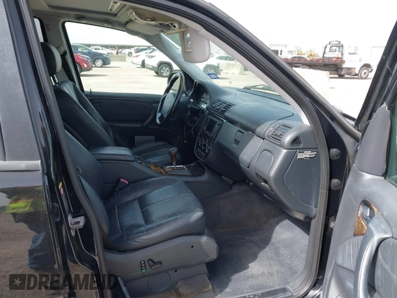 2001 Mercedes-Benz M-Class AMG with VIN 4JGAB74E51A272841, listed as a IAAI auction lot 41734340 with 168,387 mi miles. Bid and sale history available at carsss.com. Image 5.