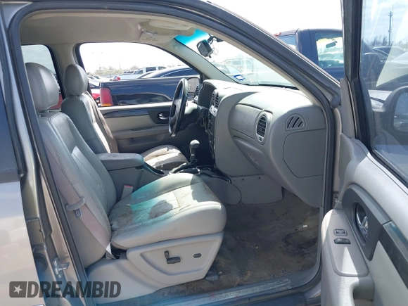 2006 GMC Envoy SLT with VIN 1GKDS13S462185122, listed as a IAAI auction lot 41778816 with 220,974 mi miles. Bid and sale history available at carsss.com. Image 5.