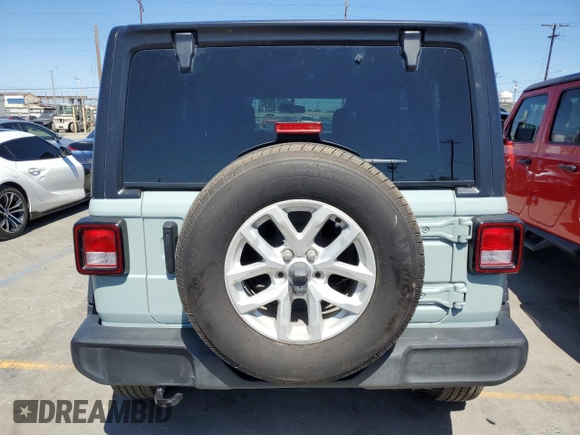 2023 Jeep Wrangler Sport S with VIN 1C4HJXDG5PW623797, listed as a Copart auction lot 66359625 with 16,518 mi miles and Salvage title. Bid and sale history available at DreamBid. Image 6.