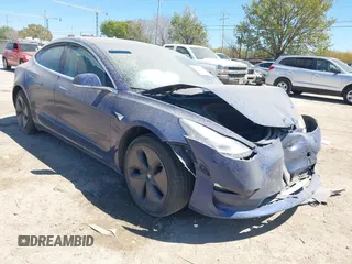 2020 Tesla Model 3 Standard Range Plus z VIN 5YJ3E1EA2LF739866, wystawiony jako IAAI lot #41842179 z przebiegiem 70 089 mil mil oraz . Historia ofert i sprzedaży dostępna na DreamBid. Obrazek 1.