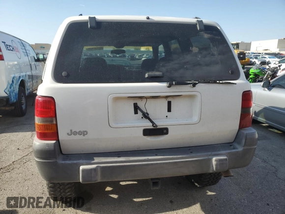 1998 Jeep Grand Cherokee Laredo with VIN 1J4GZ58S6WC319444, listed as a Copart auction lot 53147665 with 217,068 mi miles and Salvage Title. Bid and sale history available at carsss.com. Image 6.