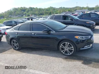 2017 Ford Fusion Titanium with VIN 3FA6P0K91HR257462, listed as a IAAI auction lot 42079361 with 124,914 mi miles and . Bid and sale history available at DreamBid. Image 13.