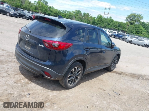 2016 Mazda CX-5 Grand Touring z VIN JM3KE4DY1G0817562, wystawiony jako IAAI lot #42289929 z przebiegiem 135 476 mil mil oraz . Historia ofert i sprzedaży dostępna na DreamBid. Obrazek 4.