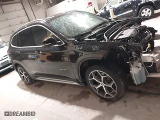 2016 BMW X1 xDrive28i with VIN WBXHT3C33GP886935, listed as a IAAI auction lot 41707367 with 73,201 mi miles. Bid and sale history available at carsss.com. Image 14.