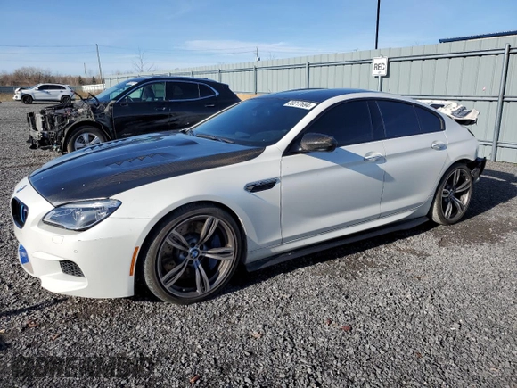 2017 BMW M6 with VIN WBS6E9C56HG437410, listed as a Copart auction lot 80217694 with 68,335 mi miles and Salvage title. Bid and sale history available at DreamBid. Image 1.