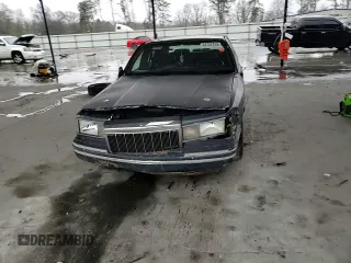 1995 Lincoln Town Car Signature z VIN 1LNLM82W0SY744473, wystawiony jako Copart lot #44752735 z przebiegiem Nie podano mil oraz Szkoda całkowita • Salvage title. Historia ofert i sprzedaży dostępna na DreamBid. Obrazek 11.