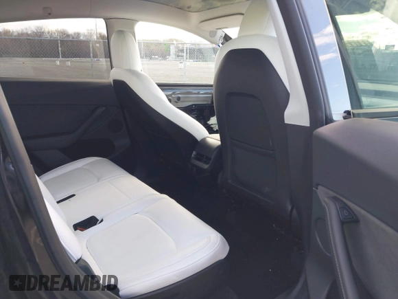 2022 Tesla Model Y Long Range with VIN 7SAYGAEE4NF522330, listed as a IAAI auction lot 42046691 with 59,980 mi miles and . Bid and sale history available at carsss.com. Image 8.
