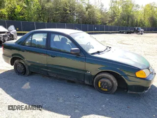 1999 Mazda Protege DX with VIN JM1BJ2223X0139775, listed as a Copart auction lot 54338455 with 63,198 mi miles and Salvage Title. Bid and sale history available at DreamBid. Image 4.