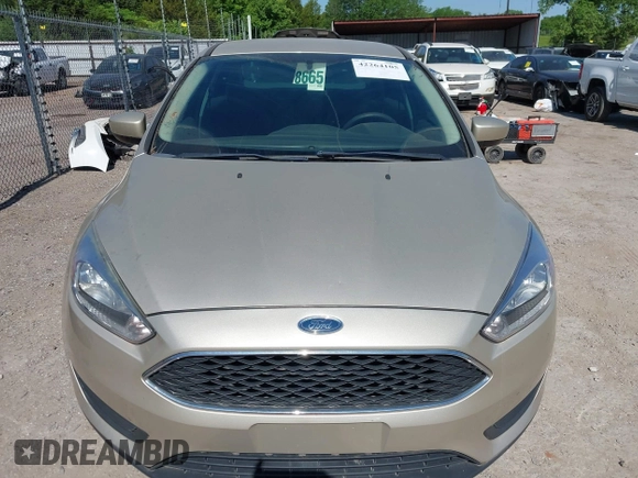 2018 Ford Focus SE z VIN 1FADP3FEXJL210905, wystawiony jako IAAI lot #42264105 z przebiegiem 136 499 mil mil oraz . Historia ofert i sprzedaży dostępna na DreamBid. Obrazek 6.