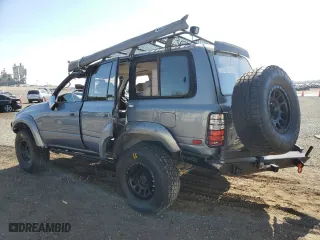 1996 Toyota Land Cruiser with VIN JT3HJ85J0T0145838, listed as a Copart auction lot 77593764 with 158,507 mi miles and Salvage Title. Bid and sale history available at carsss.com. Image 2.