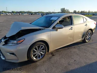 2016 Lexus ES 300h Hybrid with VIN JTHBW1GG4G2106710, listed as a IAAI auction lot 41684479 with 144,559 mi miles. Bid and sale history available at carsss.com. Image 18.