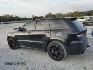 2012 Jeep Grand Cherokee SRT8 with VIN 1C4RJFDJ2CC329621, listed as a Copart auction lot 86772154 with 236,800 mi miles and Salvage Title. Bid and sale history available at carsss.com. Image 2.