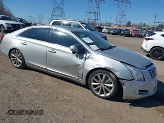 2014 Cadillac XTS Premium with VIN 2G61P5S33E9309384, listed as a IAAI auction lot 41535460 with 102,515 mi miles. Bid and sale history available at carsss.com. Image 1.