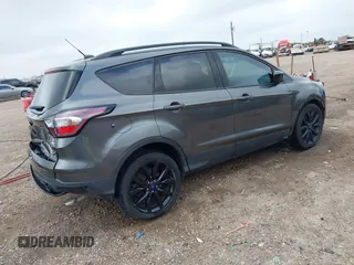 2017 Ford Escape SE with VIN 1FMCU0G99HUC65571, listed as a IAAI auction lot 41923517 with 77,179 mi miles and . Bid and sale history available at DreamBid. Image 4.