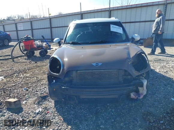 2014 MINI Countryman S with VIN WMWZC3C5XEWP52054, listed as a IAAI auction lot 41452354 with 104,873 mi miles and . Bid and sale history available at DreamBid. Image 13.
